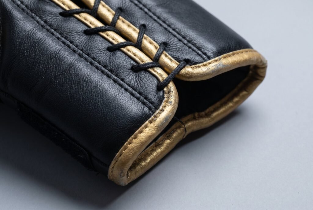 Close-up of the stitching and seam construction on a Combat Master boxing glove